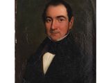 portrait of a man in a black coat and bow tie