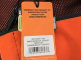 an orange bag with a tag on it sitting on top of a table