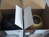 two boxes with a speaker inside of them sitting on a table