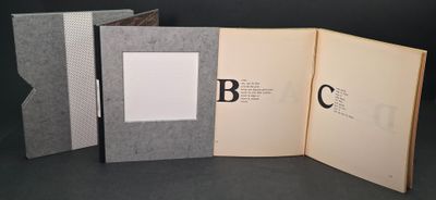 three open books that are sitting on a table
