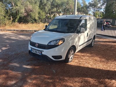 a white van that is parked on the side of the road