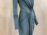 the mannequin is wearing a blue dress with a knot around the waist