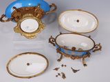 several pieces of blue and white porcelain with gold trims