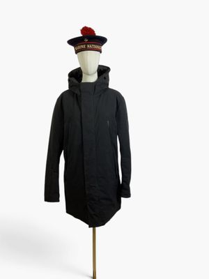 an image of a mannequin wearing a black coat and a red hat