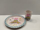 a small plate and a cup sitting on a table
