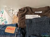 a pile of clothing that is sitting on a table