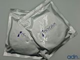 two packets of involux sit on a table next to each other