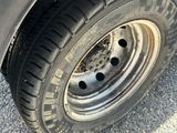 a close up of a tire on a flatbed truck