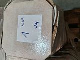 a pile of toilet paper sitting on top of a wooden pallet