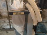 an image of a dust collector machine in a basement