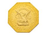 l'image d'une pièce d'or ornée d'un aigle