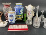 a lot of glass vases and other glass items on the table