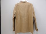 the back of a tan jacket hanging on a white hanger