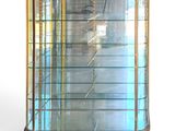 a display case with glass shelves in the middle of it