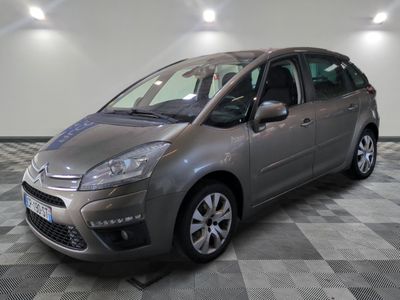 the grey citrole is parked on a checkered tile floor