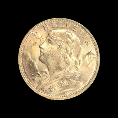 gros plan d'une pièce d'or avec un visage de femme
