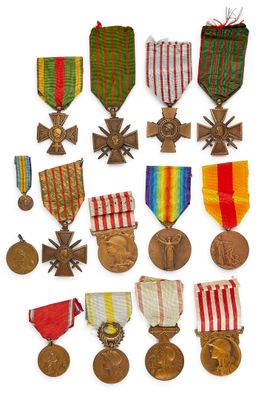 an assortment of medals and medals are displayed on a white surface