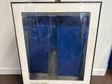 an image of a framed picture of a blue building
