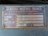 a sign on the side of a blue machine