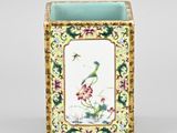 an image of a vase with a bird and flowers painted on it