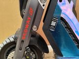 a scooter that is sitting on the floor