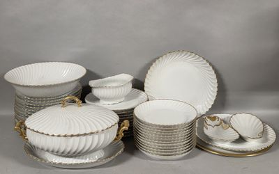 a lot of plates and bowls on the table