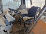 a bus that has a seat and a chair inside of it
