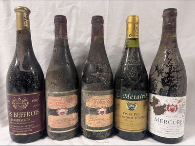 several bottles of wine are lined up on a table