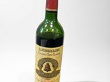 a bottle of wine that is sitting on a table