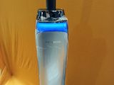 a blender sitting on top of a table next to a cell phone