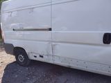 a white van that is parked on the side of the road