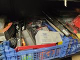 a blue basket filled with assorted items in a store