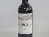a bottle of wine that is sitting on a table