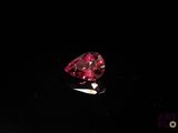 a red diamond on a black surface
