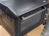 a black toaster oven sitting on top of a cardboard box
