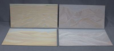 four different types of wood panels on a gray background