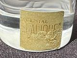 a glass jar with a label on it sitting on a table