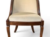 an image of a wooden chair with a beige upholstered seat
