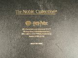 a close up of a black book with gold lettering on it