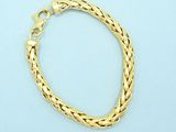 a gold bracelet on a blue background