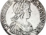 a close up of a coin with a woman ' s head on it