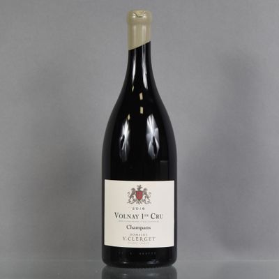 a bottle of red wine sitting on top of a table