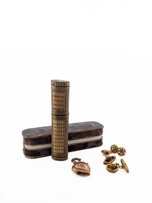 a lighter that is sitting next to some other items