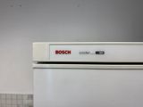 a close up of a white refrigerator with a bosch coder on it