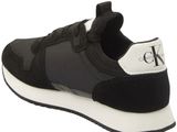 a close up of a pair of black and white sneakers