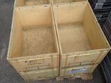 four wooden crates stacked on top of each other in a warehouse