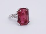 a close up of a ring with a pink tourmaline stone