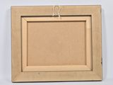 an image of a picture frame hanging on a wall with a string