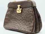 a brown ostrich ostrich leather handbag with gold hardware
