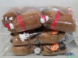 a bunch of stuffed animals wrapped in plastic bags